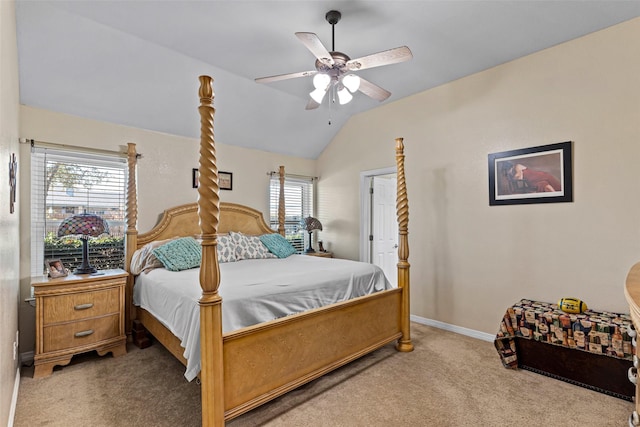 carpeted bedroom with ceiling fan, lofted ceiling, and multiple windows