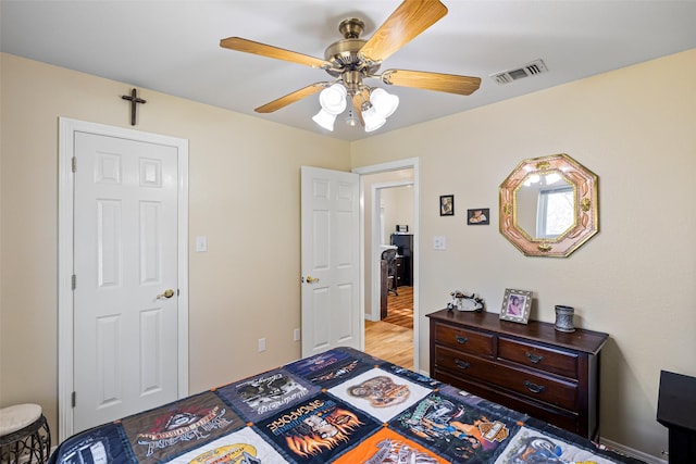 bedroom with ceiling fan and light hardwood / wood-style flooring