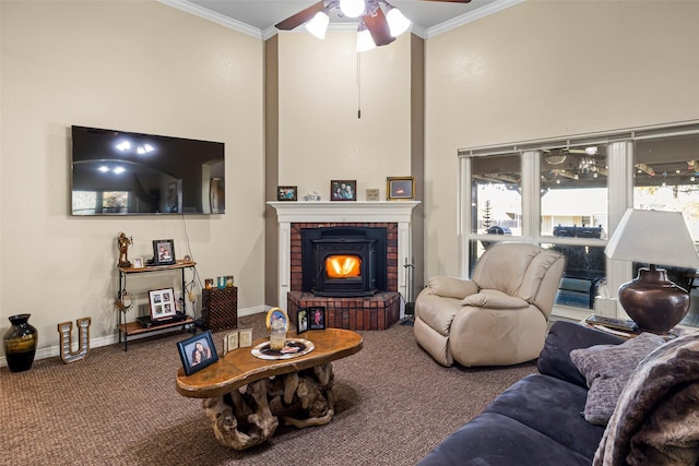 carpeted living room featuring ceiling fan, ornamental molding, and a high ceiling