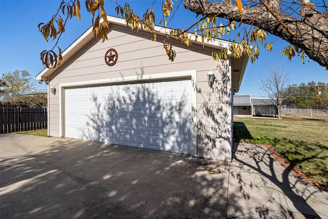 garage featuring a lawn