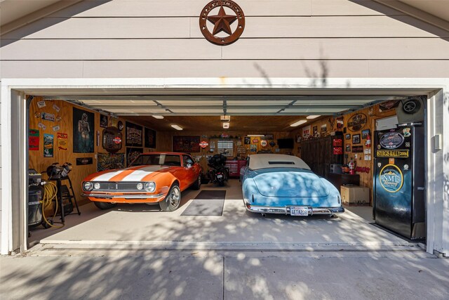 garage featuring wood walls