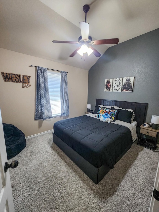 carpeted bedroom with vaulted ceiling and ceiling fan