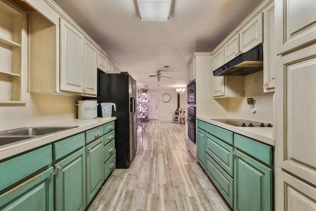 kitchen featuring green cabinets, black appliances, ceiling fan, and light wood-type flooring