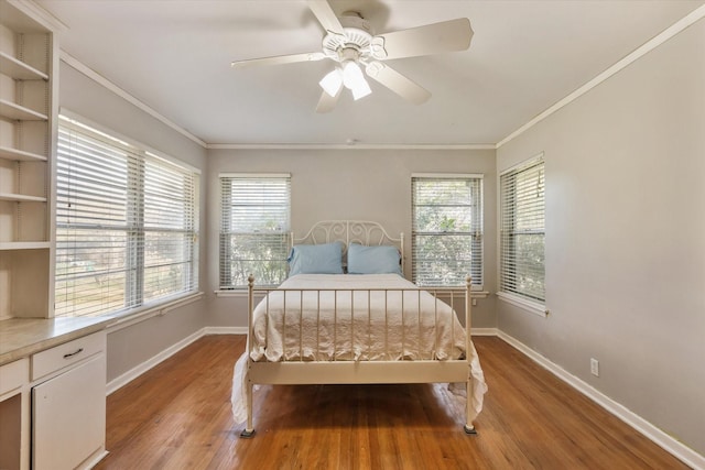 bedroom with ceiling fan, ornamental molding, and light wood-type flooring