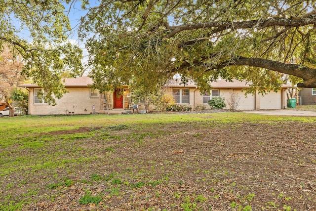 view of front facade with a garage and a front yard