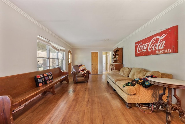 living room with ornamental molding and hardwood / wood-style floors