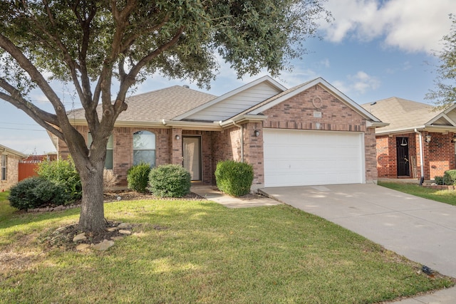 view of front of property with a front lawn and a garage