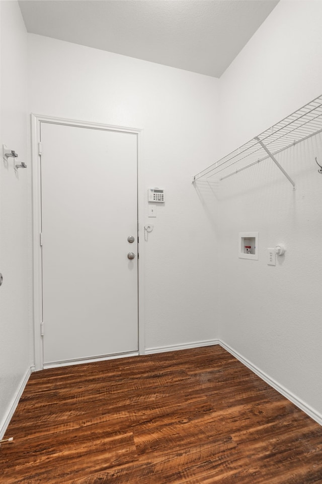 washroom with dark wood-type flooring and washer hookup