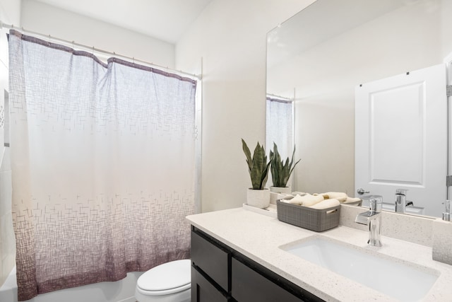 full bathroom featuring vanity, toilet, and shower / tub combo