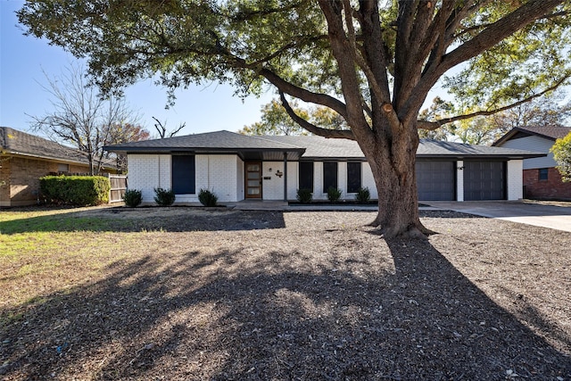 ranch-style house featuring a garage