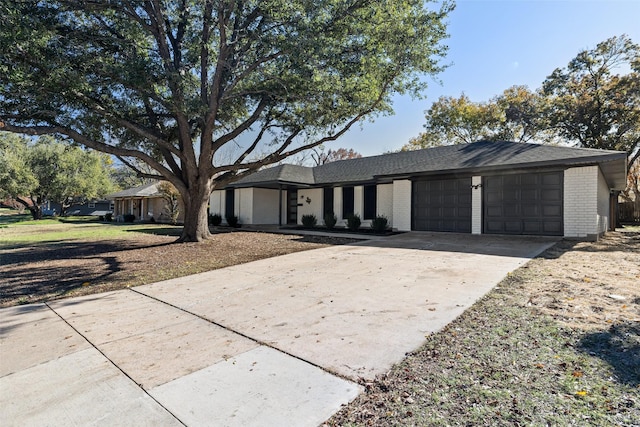 single story home featuring a garage