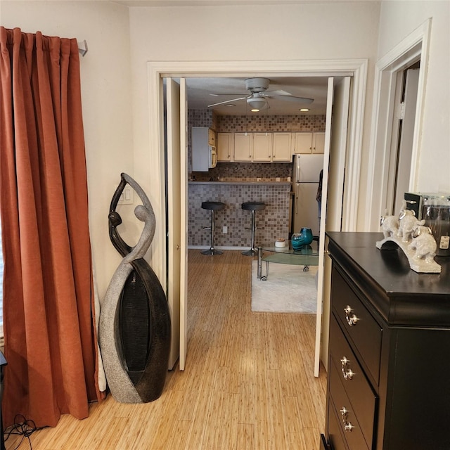 bathroom featuring hardwood / wood-style flooring and ceiling fan