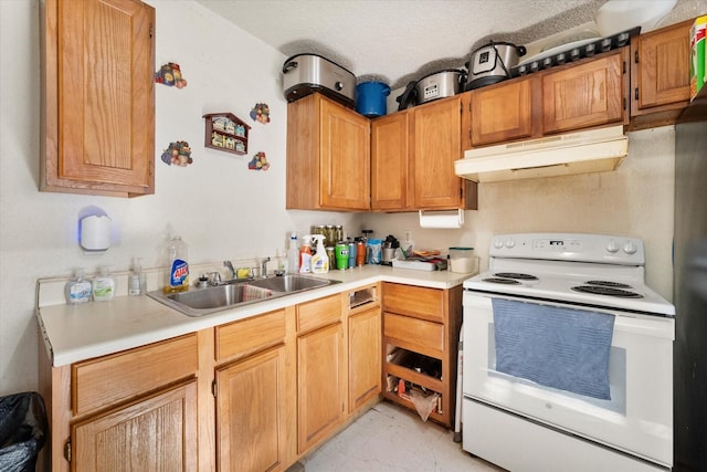 kitchen featuring white electric range oven, a textured ceiling, and sink