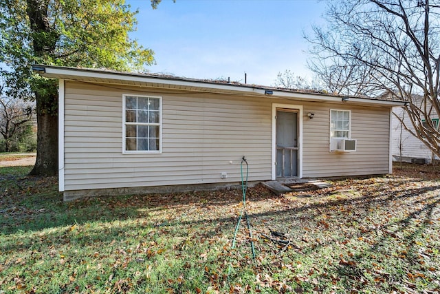 back of house featuring cooling unit