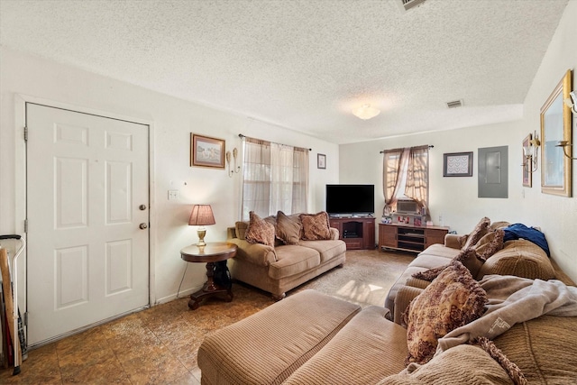 living room with a textured ceiling and electric panel