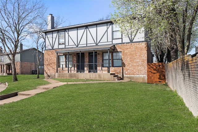 137 Montego Dr, Mesquite, TX 75149 - rear view of house featuring brick siding, a chimney, and a porch