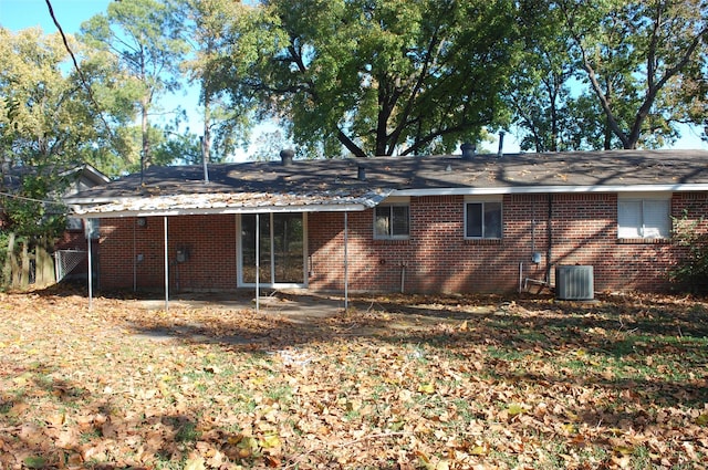 rear view of property featuring central air condition unit