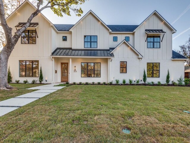 modern inspired farmhouse with a front yard