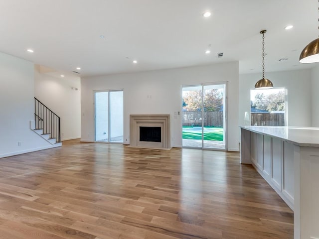 unfurnished living room with light hardwood / wood-style floors