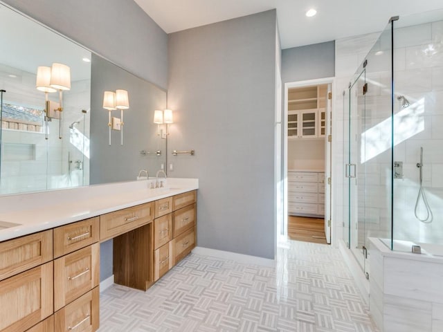 bathroom with vanity, hardwood / wood-style flooring, and a shower with door