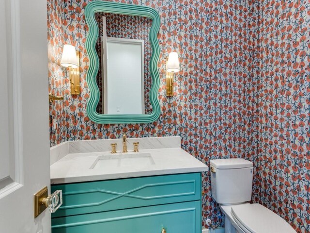 bathroom with vanity and toilet