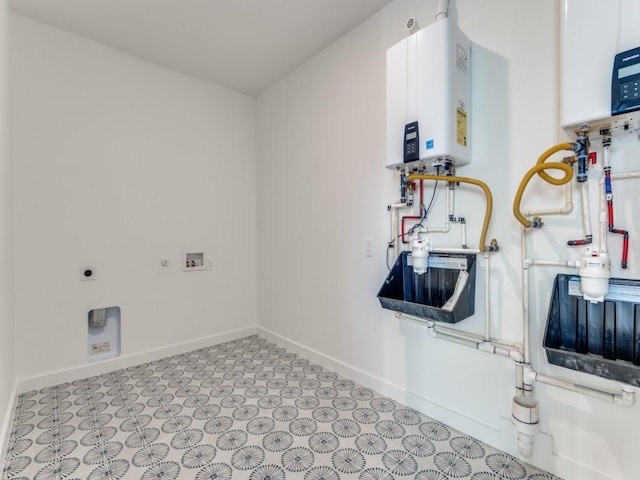 laundry area with hookup for a washing machine, electric dryer hookup, and water heater