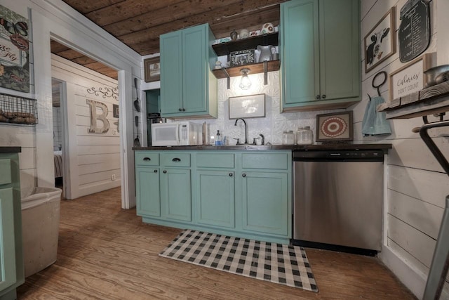 kitchen with sink, light hardwood / wood-style flooring, wooden ceiling, dishwasher, and wood walls