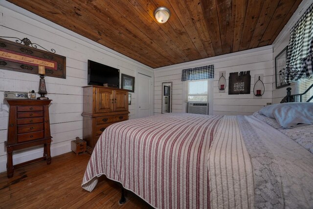 bedroom featuring hardwood / wood-style floors, wood ceiling, and wood walls