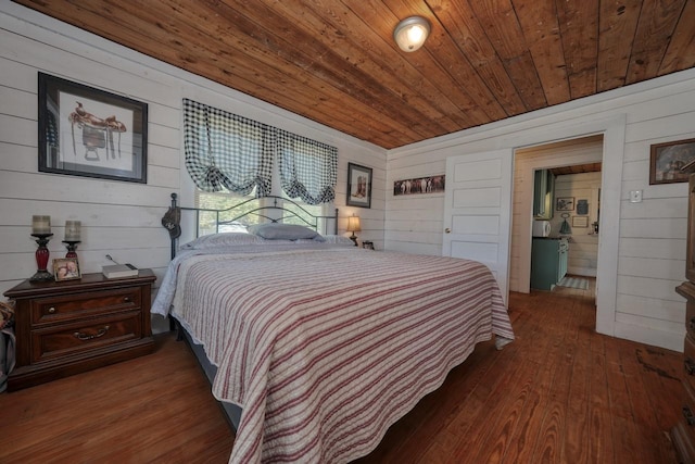 bedroom with dark hardwood / wood-style flooring, wooden ceiling, and wooden walls