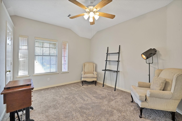 sitting room featuring carpet floors, vaulted ceiling, and ceiling fan