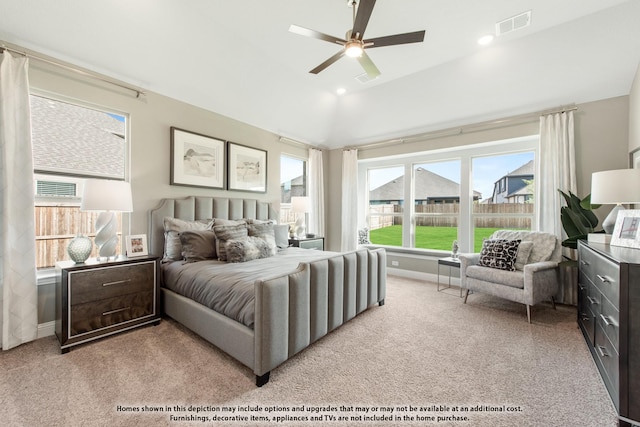 carpeted bedroom with vaulted ceiling and ceiling fan