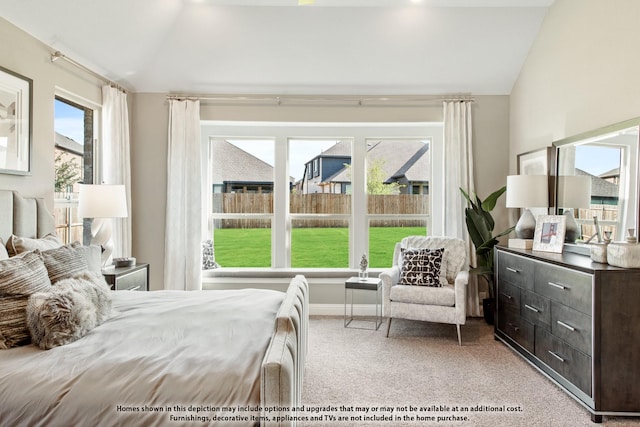 bedroom with light carpet and vaulted ceiling