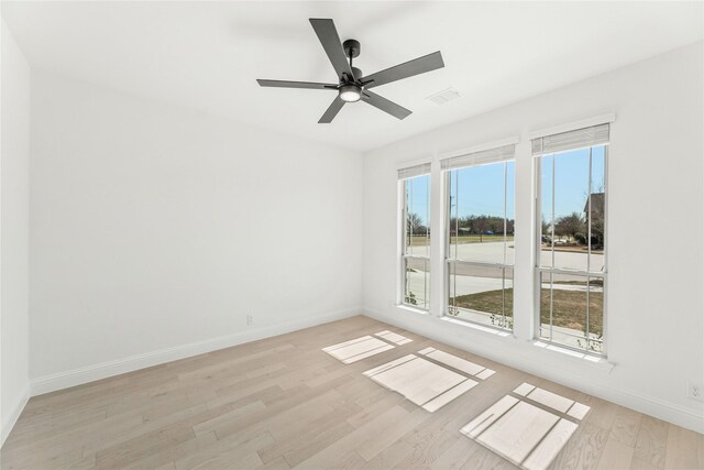 dining space featuring an inviting chandelier, hardwood / wood-style floors, and plenty of natural light