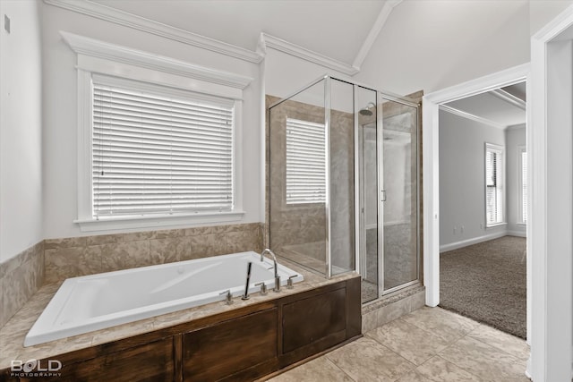 bathroom with tile patterned floors, ornamental molding, and plus walk in shower