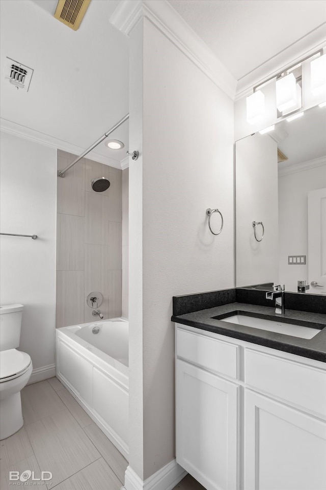 full bathroom with ornamental molding, toilet, tiled shower / bath combo, and vanity