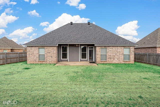 rear view of house with a patio area and a lawn