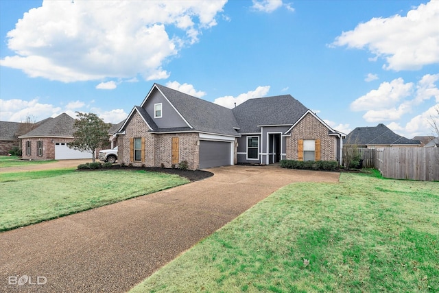 view of front of property featuring a front lawn and a garage