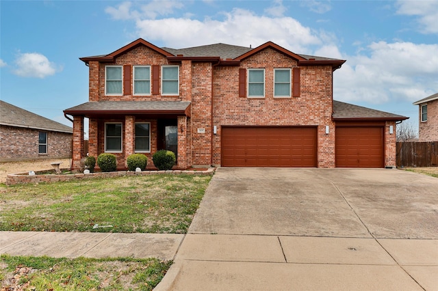 view of front of home with a garage and a front yard