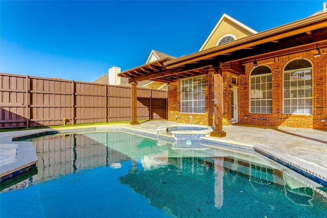 view of swimming pool featuring an in ground hot tub and a patio