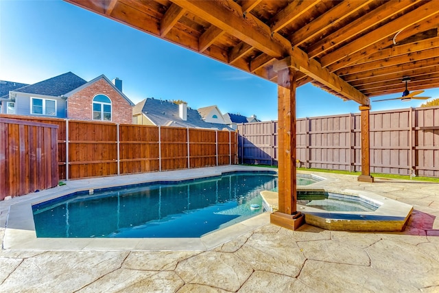 view of swimming pool featuring an in ground hot tub and a patio area