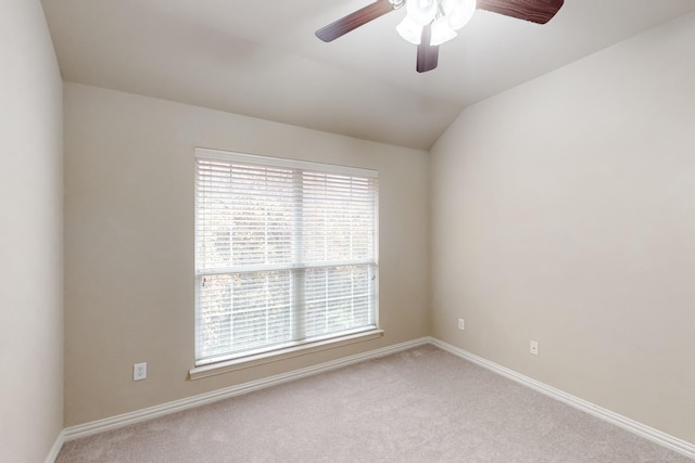 empty room with light carpet, ceiling fan, and lofted ceiling