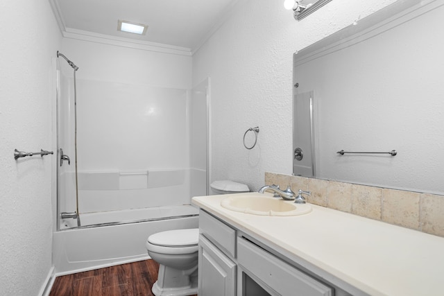 full bathroom with bathtub / shower combination, toilet, wood-type flooring, ornamental molding, and vanity