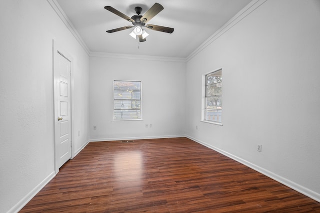 empty room with ceiling fan, ornamental molding, and dark hardwood / wood-style flooring