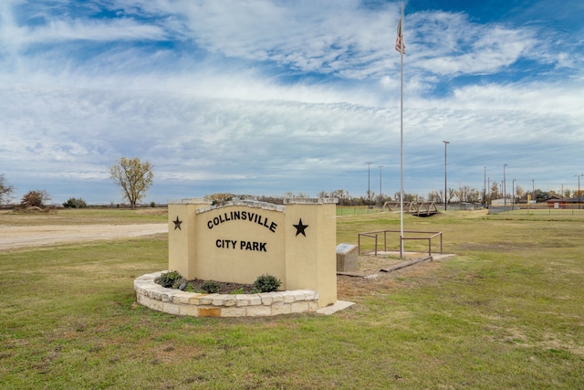 view of home's community with a lawn