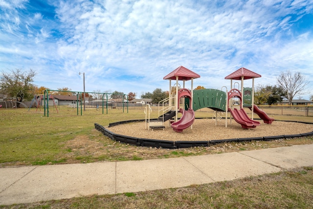 view of playground with a lawn