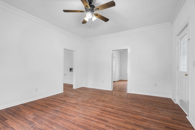 empty room featuring ceiling fan, ornamental molding, and dark hardwood / wood-style flooring