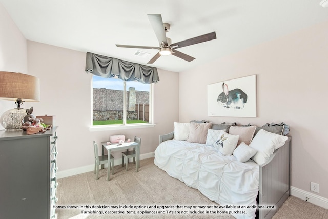 bedroom with ceiling fan and light carpet