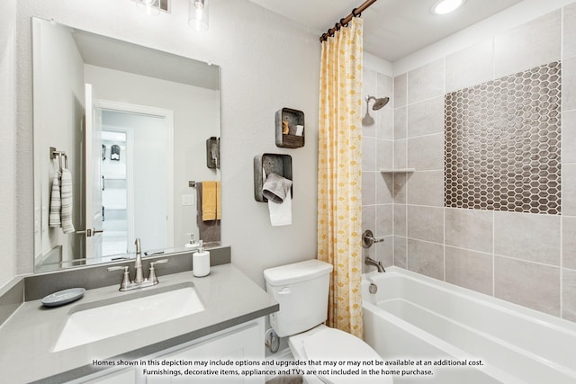 full bathroom featuring shower / tub combo, vanity, and toilet