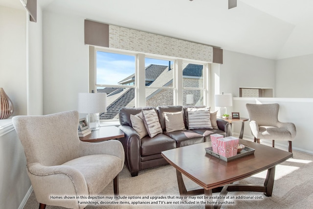 carpeted living room with vaulted ceiling