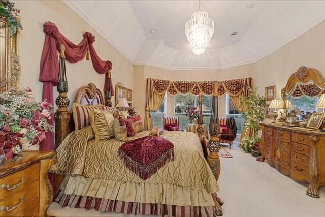 carpeted bedroom featuring a raised ceiling, crown molding, a chandelier, and vaulted ceiling